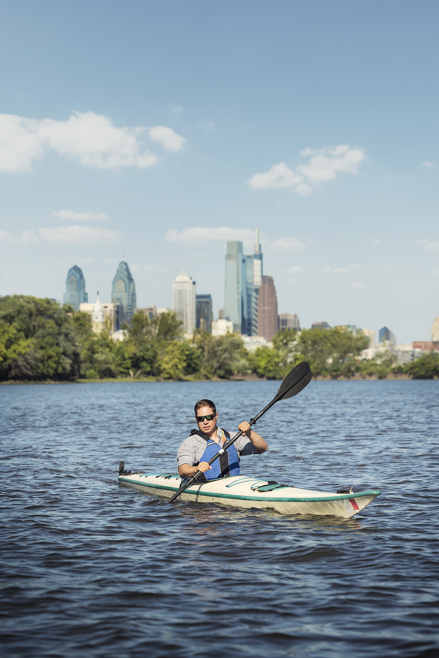 Zack Hoisington '07 paddles a kayak along the Cooper River in Camden County, N.J.