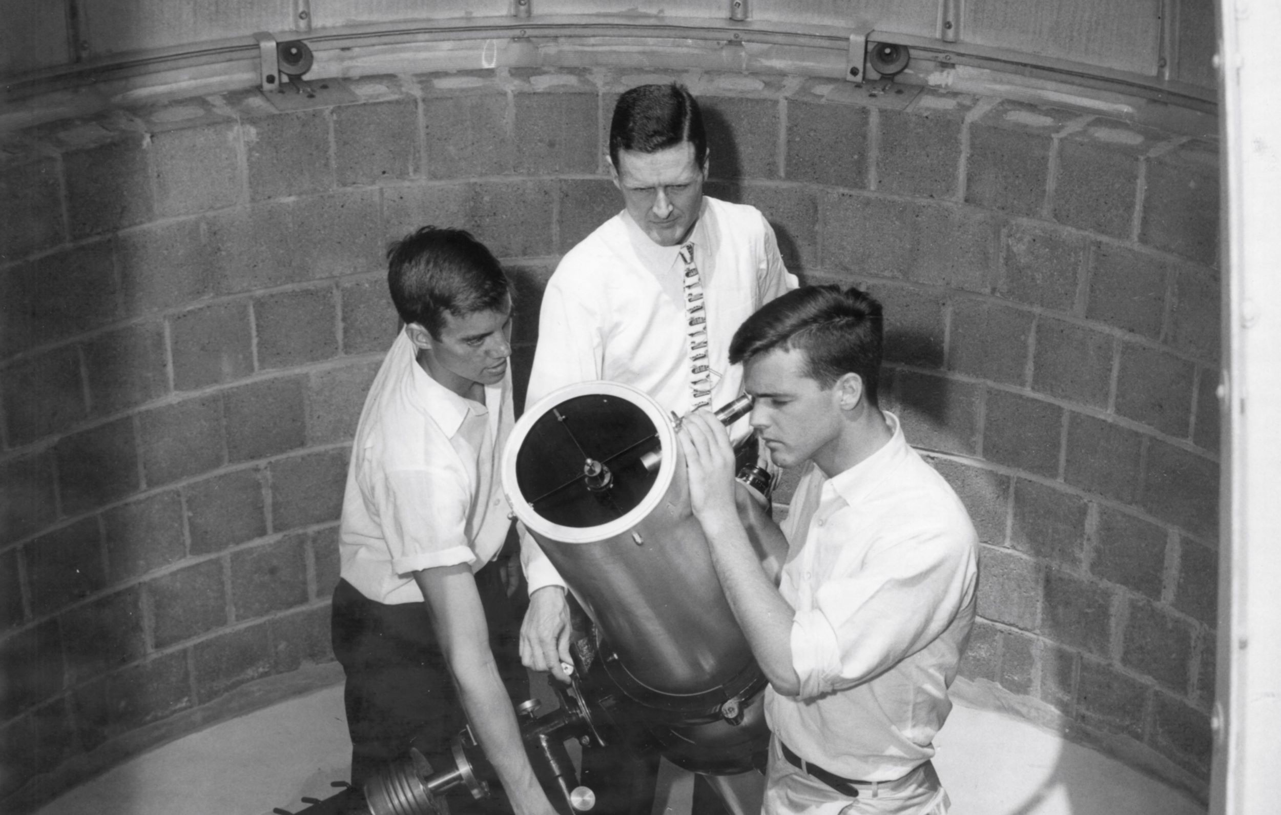 Science master Gifford Havens H’46 ’58 and his students using the observatory they built, circa 1961