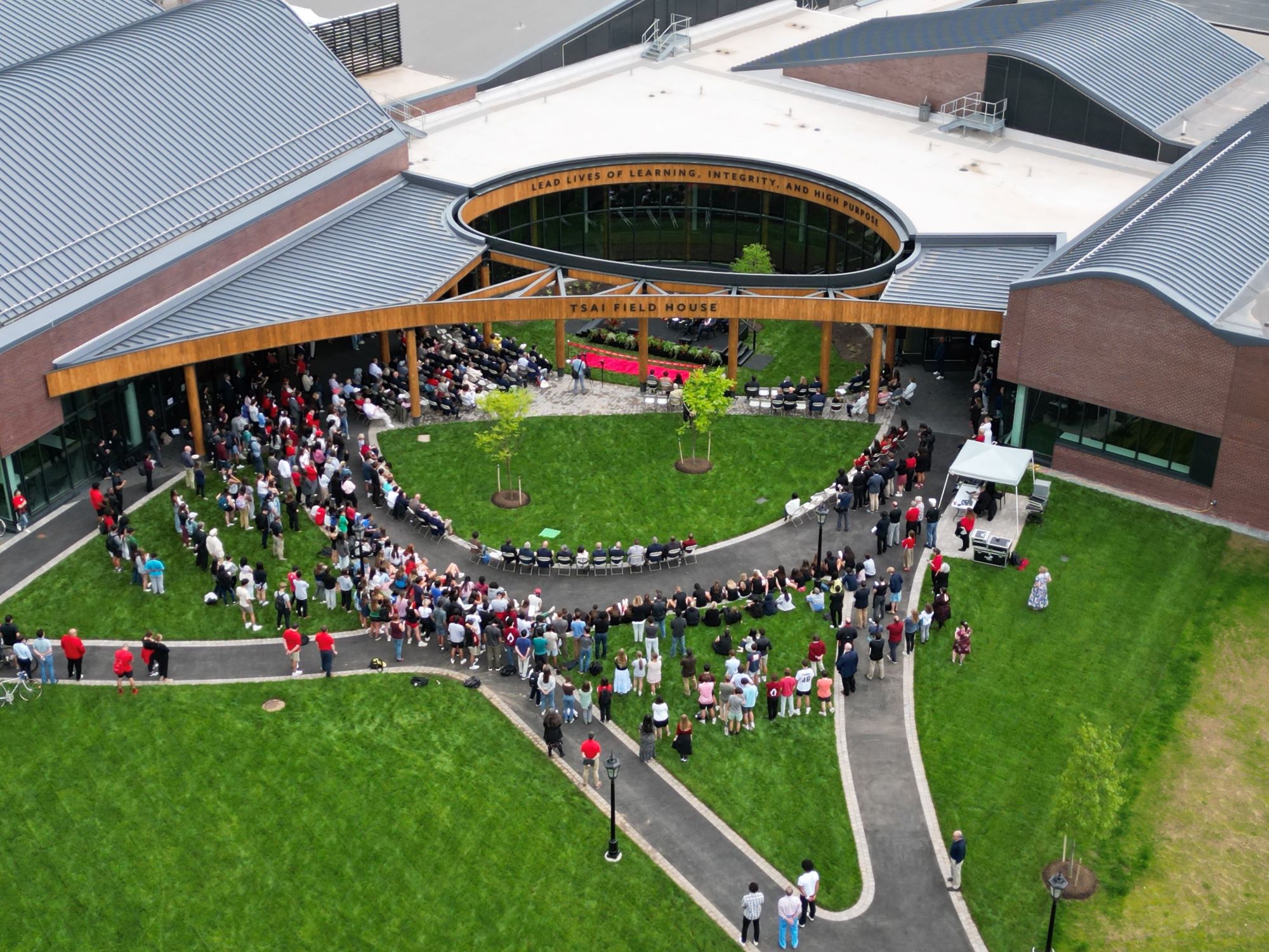 An aerial photo of the attendees at the dedication of Tsai Field House on May 17, gathered in the Harkness Courtyard.