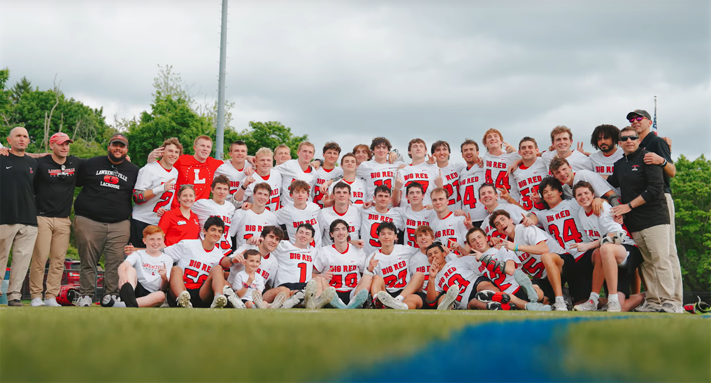 The Big Red boys' lacrosse team poses for a team photo after winning its de facto national championship game.