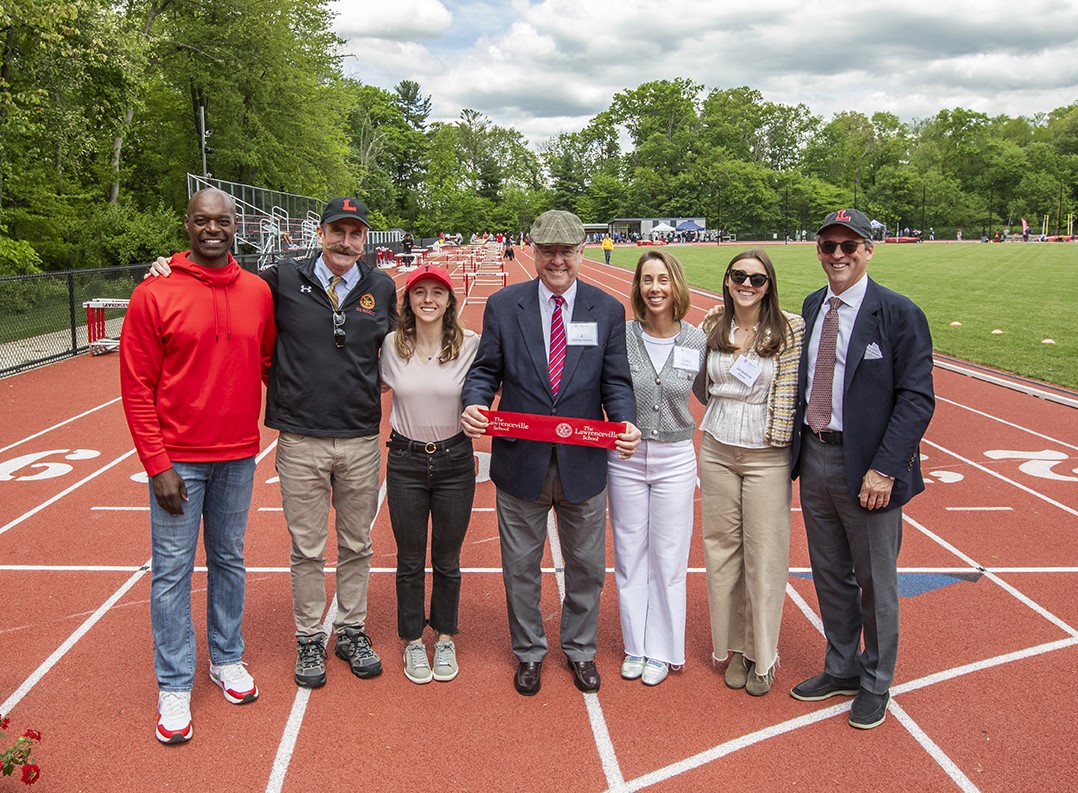 The Dishner family, along with Tripp Welborne and Steve Murray, cut the ribbon to dedicate the new Dishner Track and Field Complex