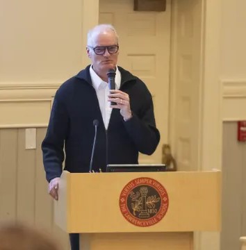 Hugh Dugan speaking in the Heely Room of Memorial Hall.