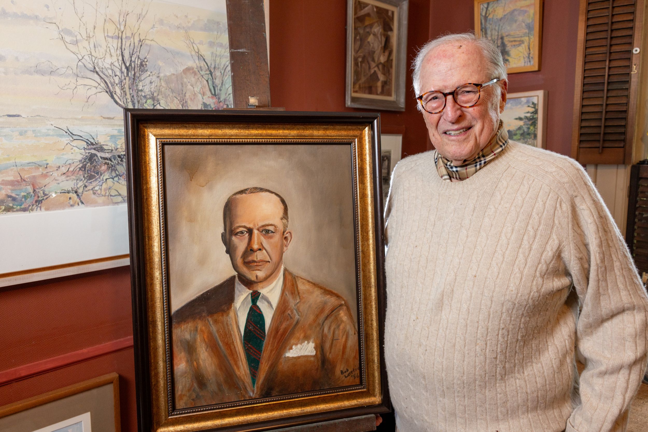 Image of Bob Lettieri '56 with a portrait he painted of Head Master Allan Heely in 1955.