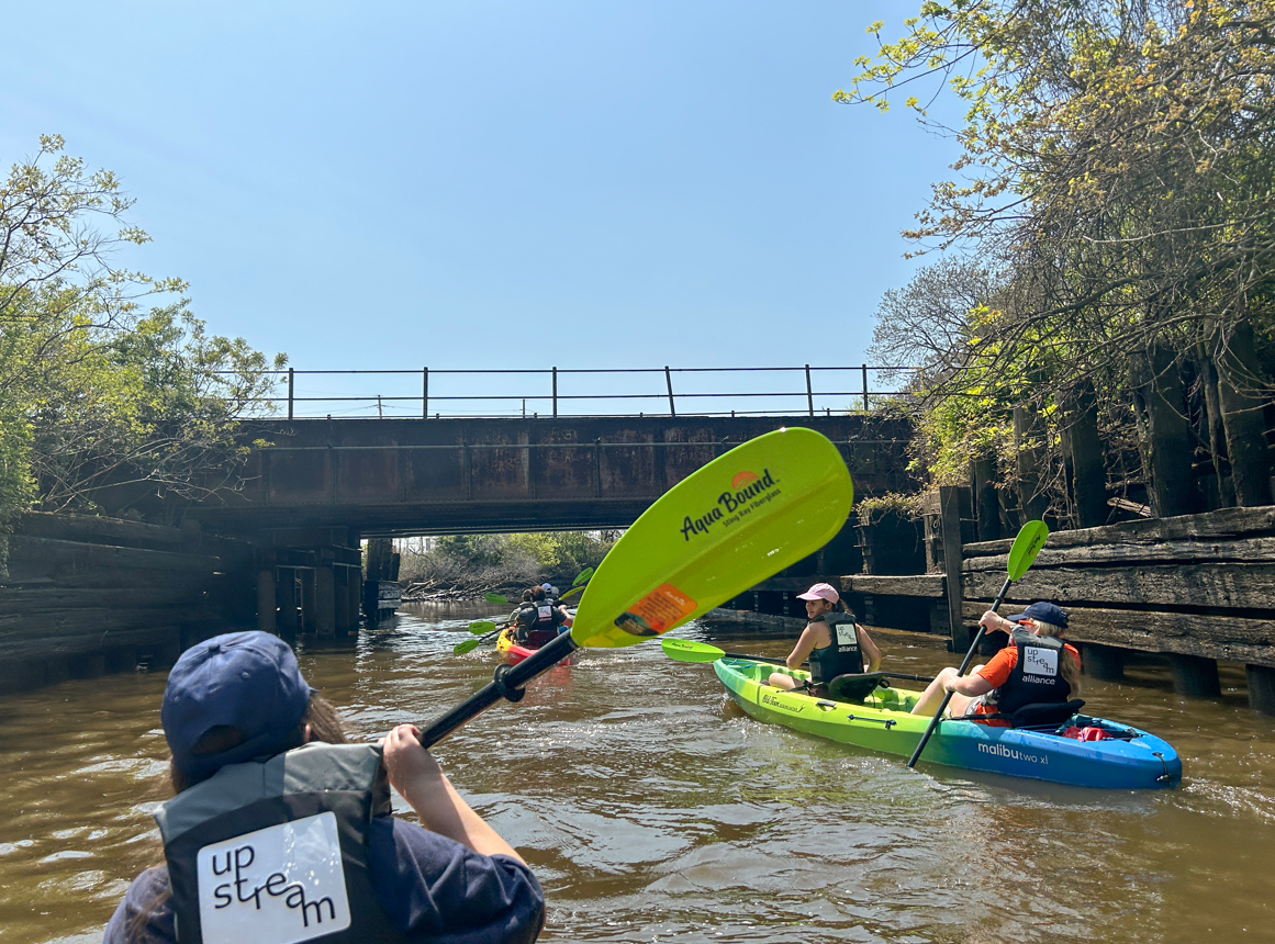 Lawrenceville students row along the Cooper River on a tour hosted by Zack Hoisington '07.