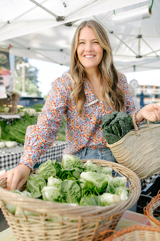 Caroline Chambers '07 picks produce at a California farmers market.