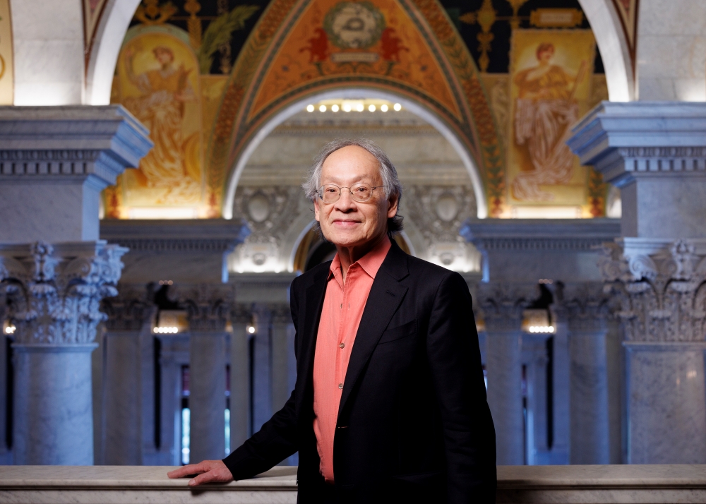 U.S. poet Laureate Arhtur Sze '68 stands with is hand on a marble railing at the Library of Congress.
