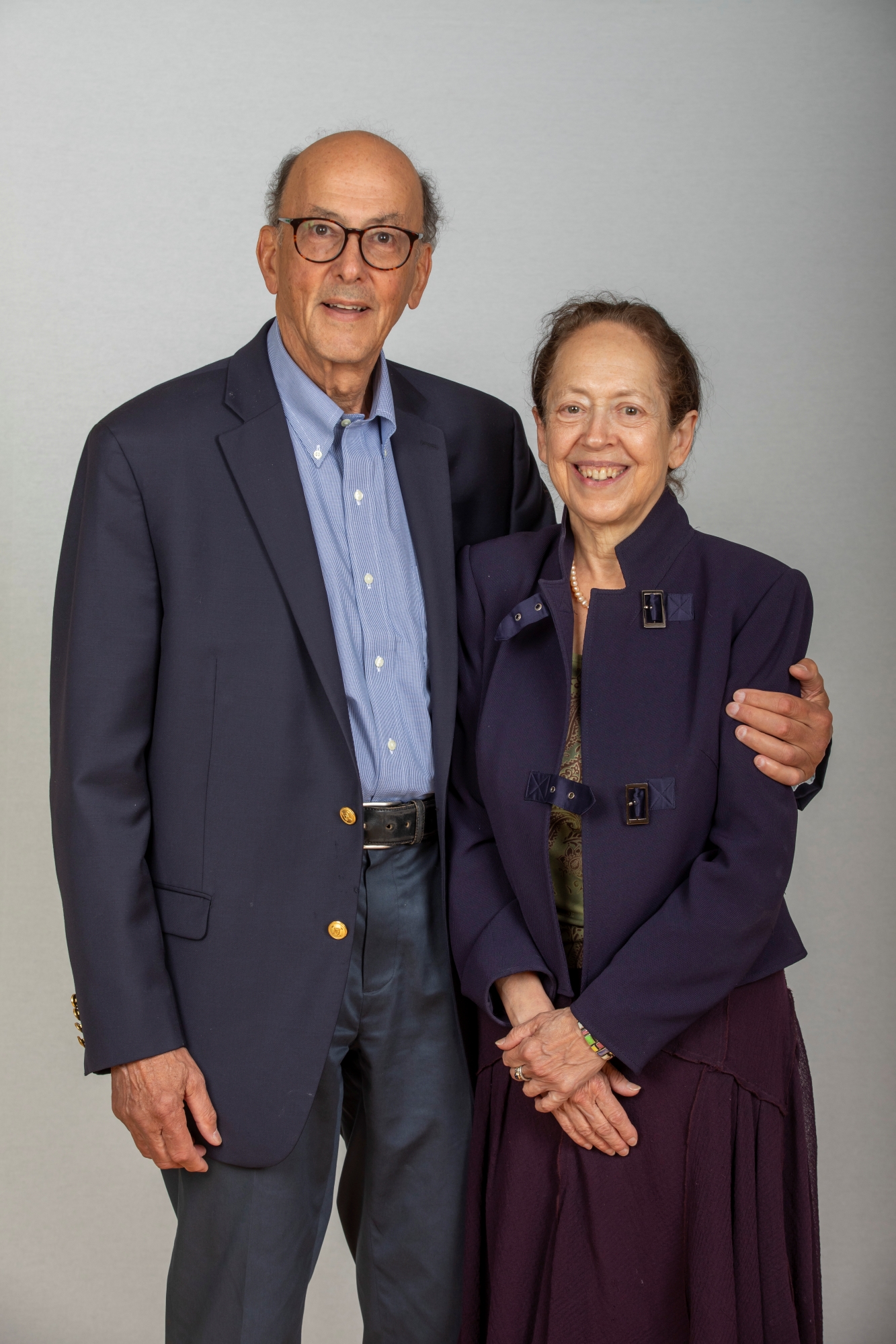 Roger Glass holds his left arm around his wife, Barbara J. Stoll, M.D.