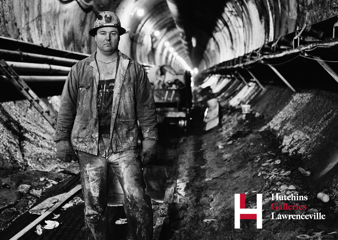 Black and white photo by Tom Grimes '78 depicting one of New York City's sandhogs, who work far underground to dig tunnels for transportation systems. The lower right corner of this iamge features the logo of the Hutchins Galleries, as it was used as a promotional postcard