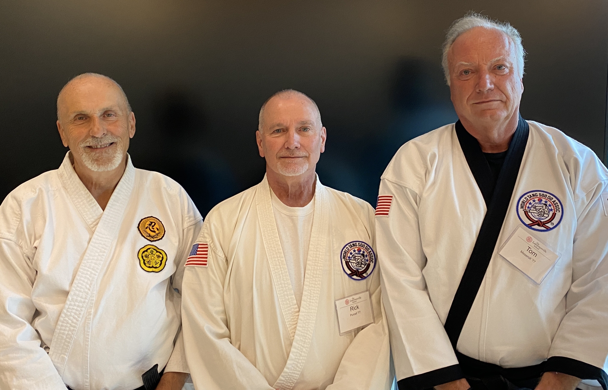 Founders Marty Picco ’77, Rick Purcell ’77, and Tom Meseroll ’77 returned to Lawrenceville to celebrate the 50th anniversary of the Karate Club, lined up in front of a black screen, wearing their white karate uniforms.