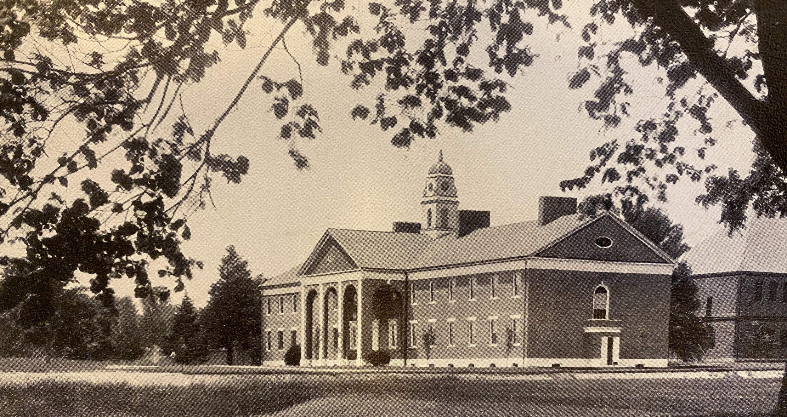 A sepia-toned 1926 photo of Pop Hall taken from a spot where Boys' Lower now stands
